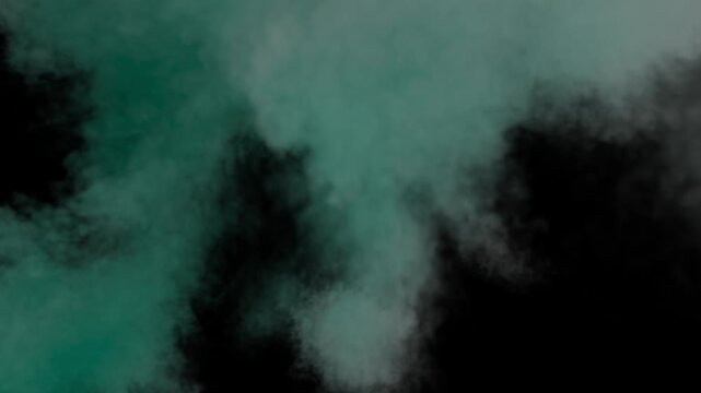 Teal green smoke puffing and filling the frame