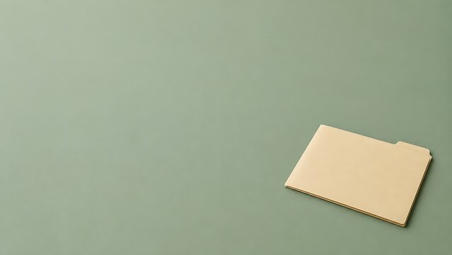 Manila file folder on muted green background with large copy space