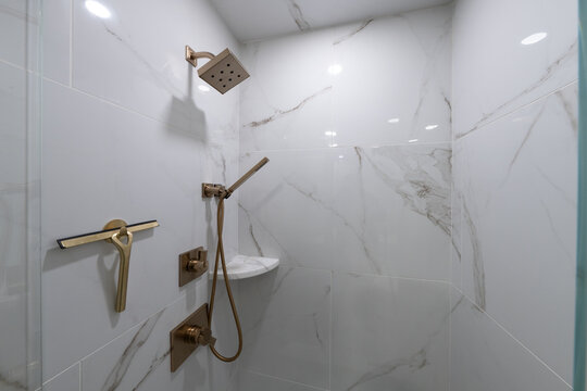 Bathroom shower has been updated with new ceramic tile and fixtures