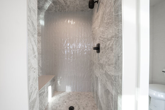 Bathroom shower has been updated with new ceramic tile and fixtures