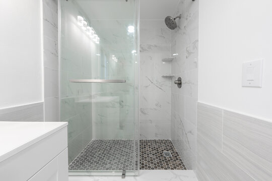 Bathroom shower has been updated with new ceramic tile and fixtures