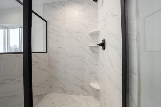 Bathroom shower has been updated with new ceramic tile and fixtures
