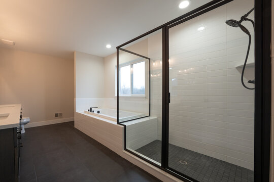 Bathroom shower has been updated with new ceramic tile and fixtures