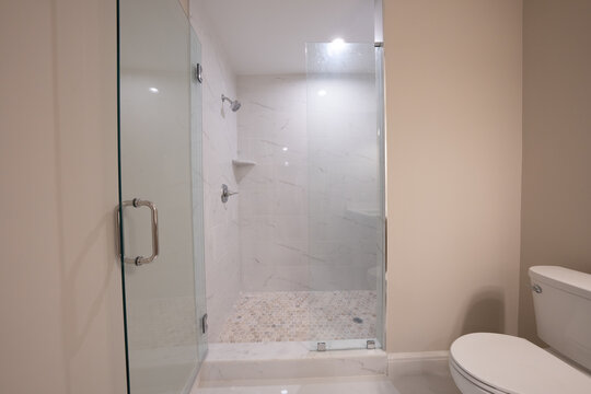 Bathroom shower has been updated with new ceramic tile and fixtures