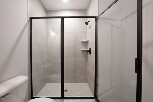 Bathroom shower has been updated with new ceramic tile and fixtures