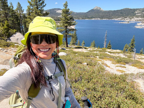 backpacker selfie hiking lake trail