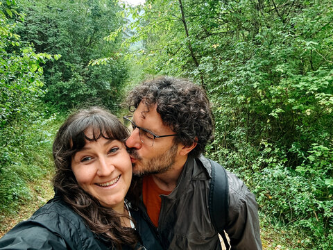 Couple sharing kiss during nature hike