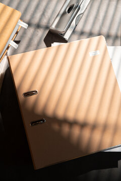 Financial Records Binder in a Sunlit Workspace