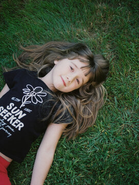 medium format film portrait of girl in garden in september