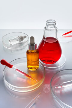 Skincare Products on a Lab Table With Pipettes and Petri Dishes