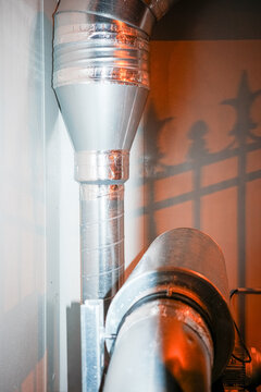 Metal HVAC duct sealed with foil tape indoors