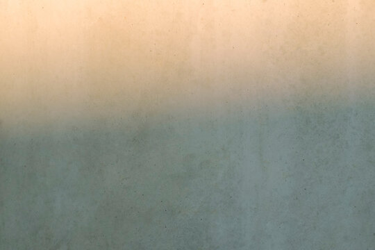 Concrete wall with graphic minimal golden hour sunlight reflection
