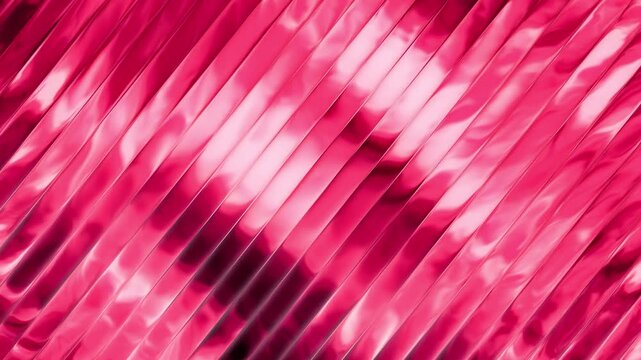 Vibrant pink metallic foil texture with diagonal pleats catching glossy light reflections across its rippling surface during movement