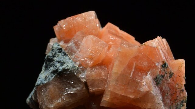 Chabazite crystals (tectosilicate mineral of the zeolite group) sample rotating slowly against a black background.