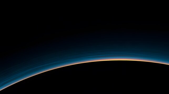 Curved horizon of a planet with glowing atmosphere in dark space