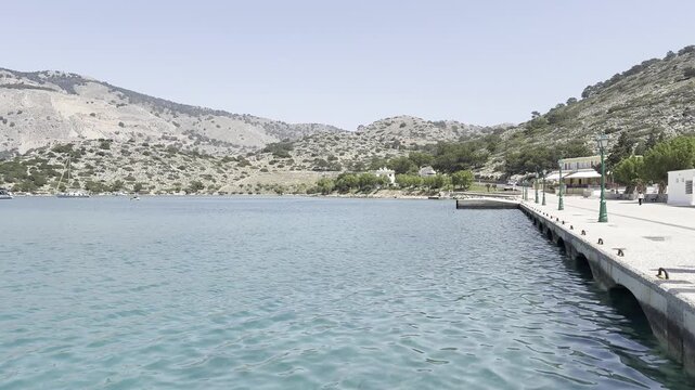 Concrete pier and turquoise water on the island of Symi, Greece