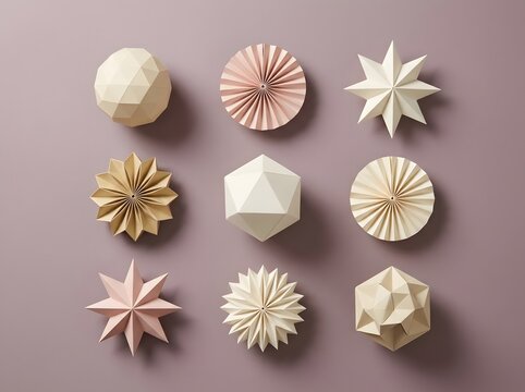 Collection of paper origami decorations in pink, cream and gold including stars, pleated fans and geometric polyhedrons on dusty mauve background, flat lay