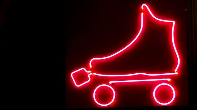 Close up of neon light in the shape of rollerskates