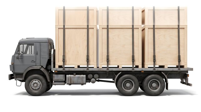 Grey flatbed truck transporting large wooden cargo crates on white