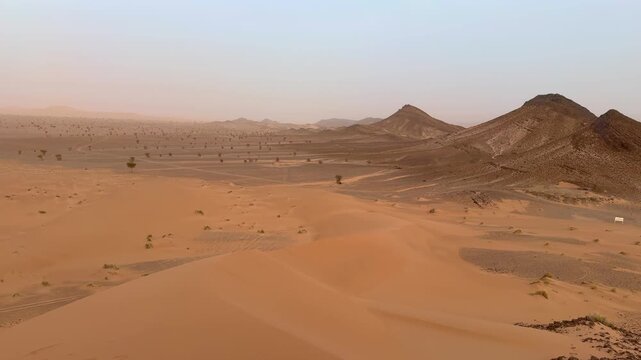 Merzouga desert at dawn with mist	