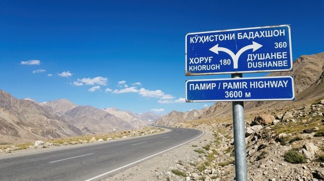Pamir Highway signpost indicating Khorugh and Dushanbe in mountainous Tajikistan Central Asia