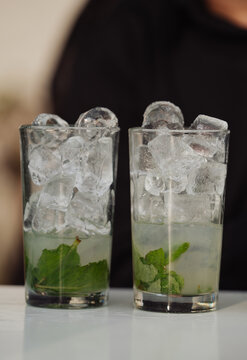Glass of lemonade with ice at an event
