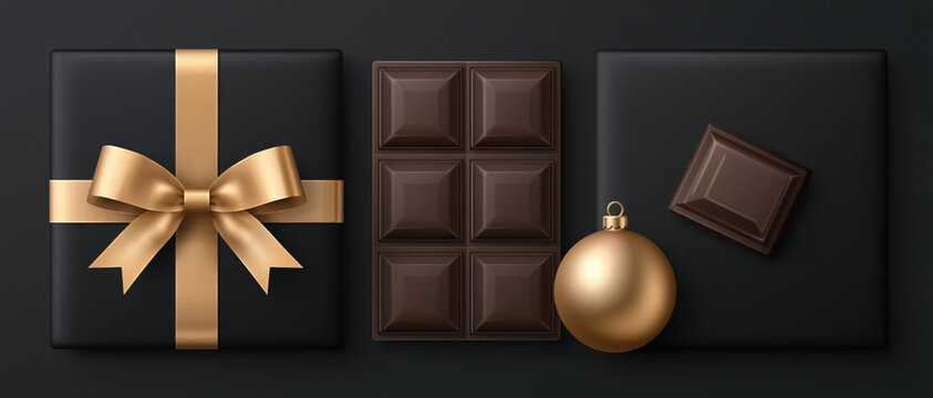 A luxurious dark chocolate bar and a beautifully wrapped gift box with a golden ribbon sit elegantly on a dark surface, accompanied by a festive golden bauble.