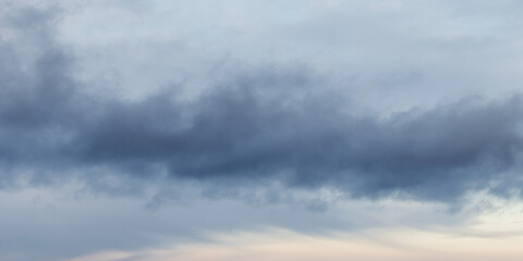 Obraz premium Blue gray stormy sky full of clouds, natural panoramic photo background 