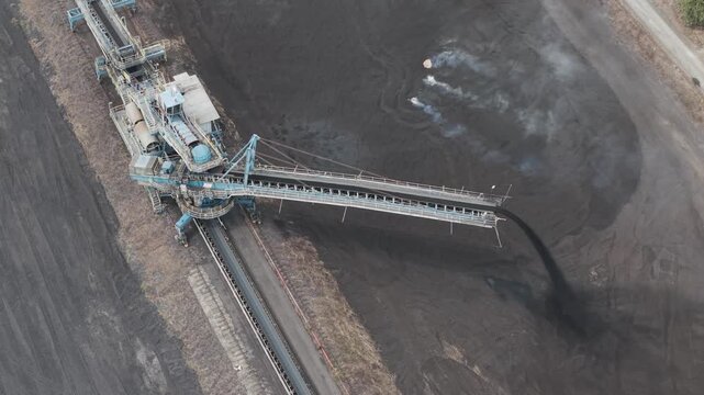 Aerial view of a stacker machine piling coal at a mine site in South Kalimantan Indonesia