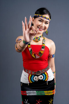 Portrait of young girl with OK sign a traditional cloth Simba Murut Tahol native of Sabah Borneo