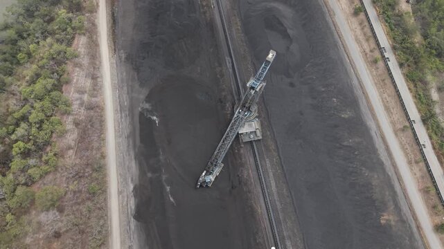 Aerial view of a stacker machine moving coal in the mining area of South Kalimantan Indonesia