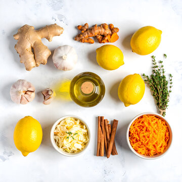 Flatlay Banner of Healthy Natural Ingredients Oil Honey Lemon Ginger and Sauerkraut.
