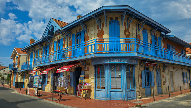 SOULAC-SUR-MER, GIRONDE, FRANCE - JUNE 26, 2019: Traditional Belle Epoque style facade of Librairie de Corinne bookshop on the corner of Andre Leroux street.