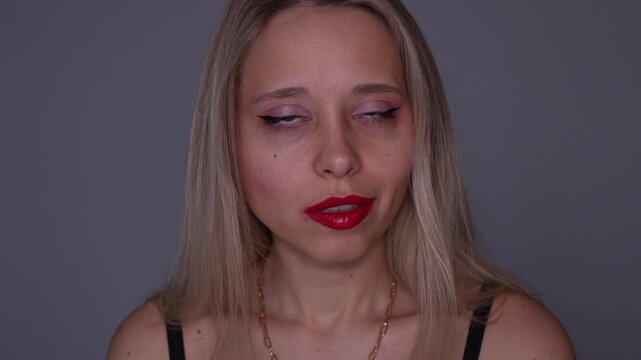Young blonde woman rolls her eyes with diva attitude, showing confident feminine arrogance, bold charm and expressive self-assured beauty energy