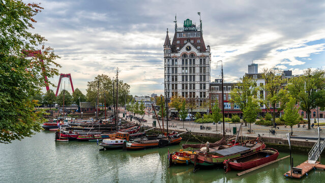Historic boats moored in Rotterdam Oude Haven (old harbor) beneath Witte Huis, ideal for travel themes