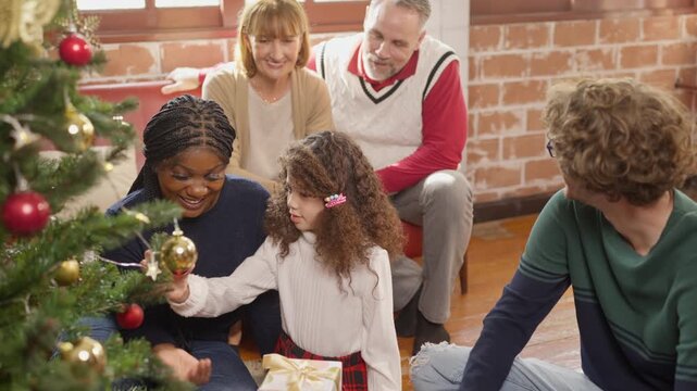 Christmas family celebrating winter relationships, holiday traditions, tree decoration, diverse relatives, joyful intergenerational connection, gift giving, warmth, and togetherness during cozy
