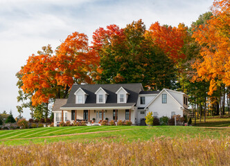 Fototapeta premium colorful autumn trees and residential house