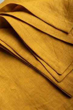 Curry Yellow Linen Fabric Hemmed Edge Texture Close Up