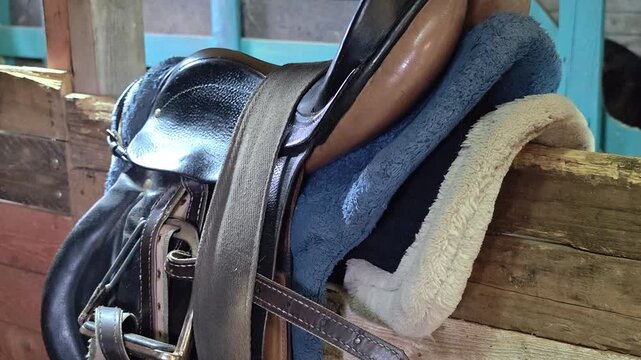 A close-up view of a horse's saddle with a blanket, great for equine-themed designs