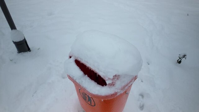 Snow Covered Orange Trash Bin Opening Winter