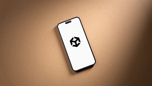 Top view of the Unity logo displayed on a smartphone lying on paper. October 7, 2026, Lisbon, Portugal.