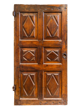 Rustic, historic single interior door made of solid walnut wood, featuring six beautifully crafted diamond-shaped or lozenge relief panels. Authentic piece of Italian craftsmanship from the 1700s 