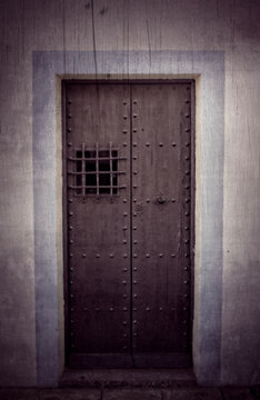 An iron door with a speakeasy grille. Book cover, poster, symbolic 