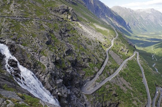 Mountain pass in Zig-Zag barren mountains, waterfall, narrow valley, Trollstigen, Way of the Trolls, Andalsnes, Norway