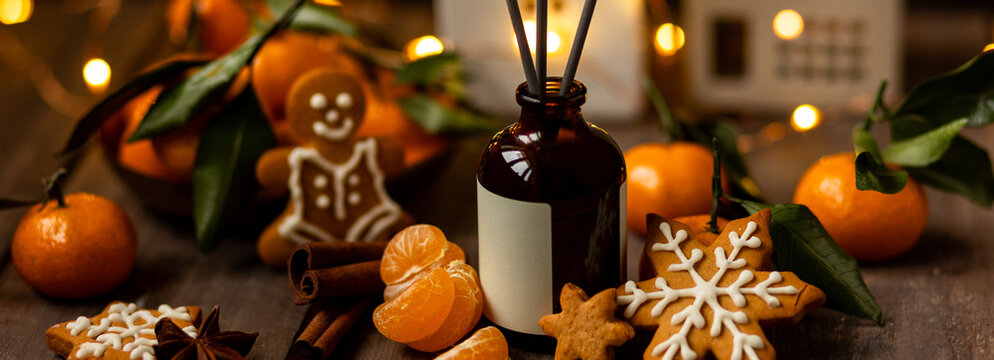 Banner. Christmas fragrance with citrus, cinnamon, anise, vanilla, gingerbread cookies. Home comfort, coziness, aromatherapy. Winter time. Cozy interior with aroma perfume diffuser in the living room