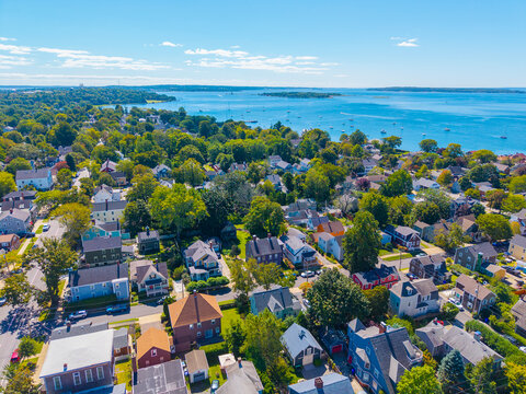 Historic residential houses aerial view with Bristol Harbor at the background in town center of Bristol, Rhode Island RI, USA. 