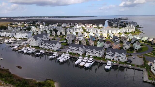 Pastel houses and white condominiums fill the neighborhood behind the marina berths.