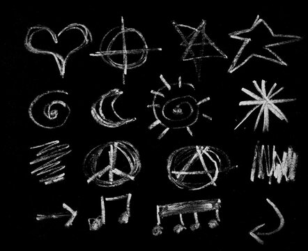 Hand drawn white chalk various symbols and doodles set on black background isolated illustration