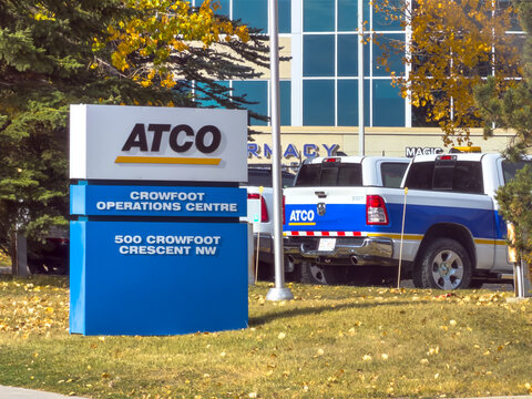 Calgary, Alberta, Canada. October 11, 2026. Exterior sign at ATCO Crowfoot Operations Centre with fleet service trucks parked outdoors.