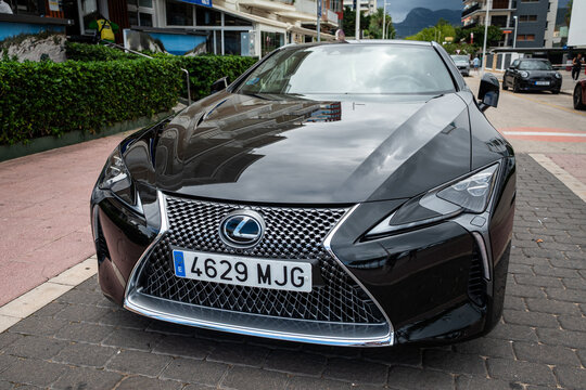 Gandia, Spain - October 3, 2026: Front view of a black 1st Generation Lexus LC 500h coupe showing the spindle grille and triple-LED headlights in Gandia.